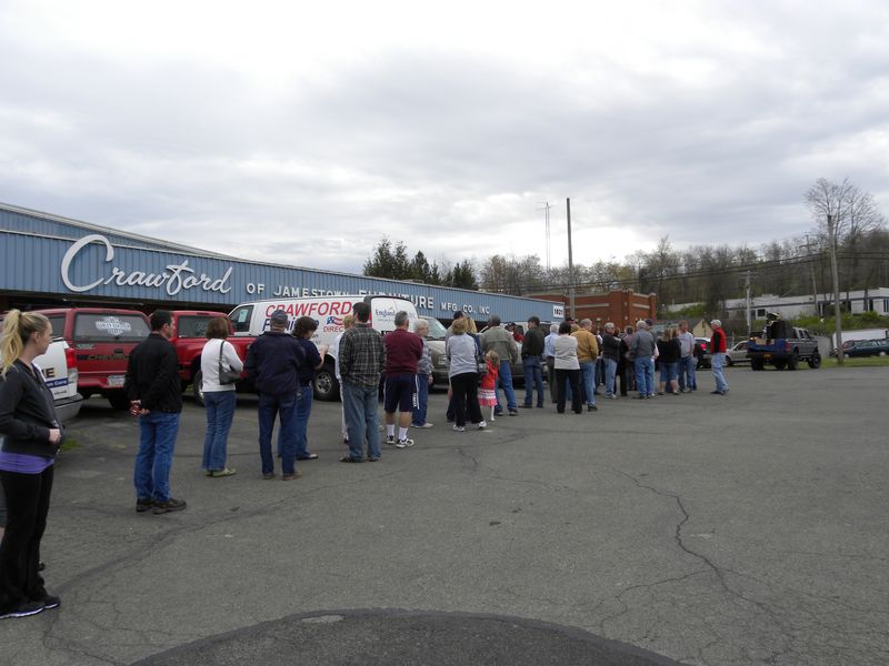 Auction bidders line up before doors open at the bankruptcy auction for Crawford Furniture
